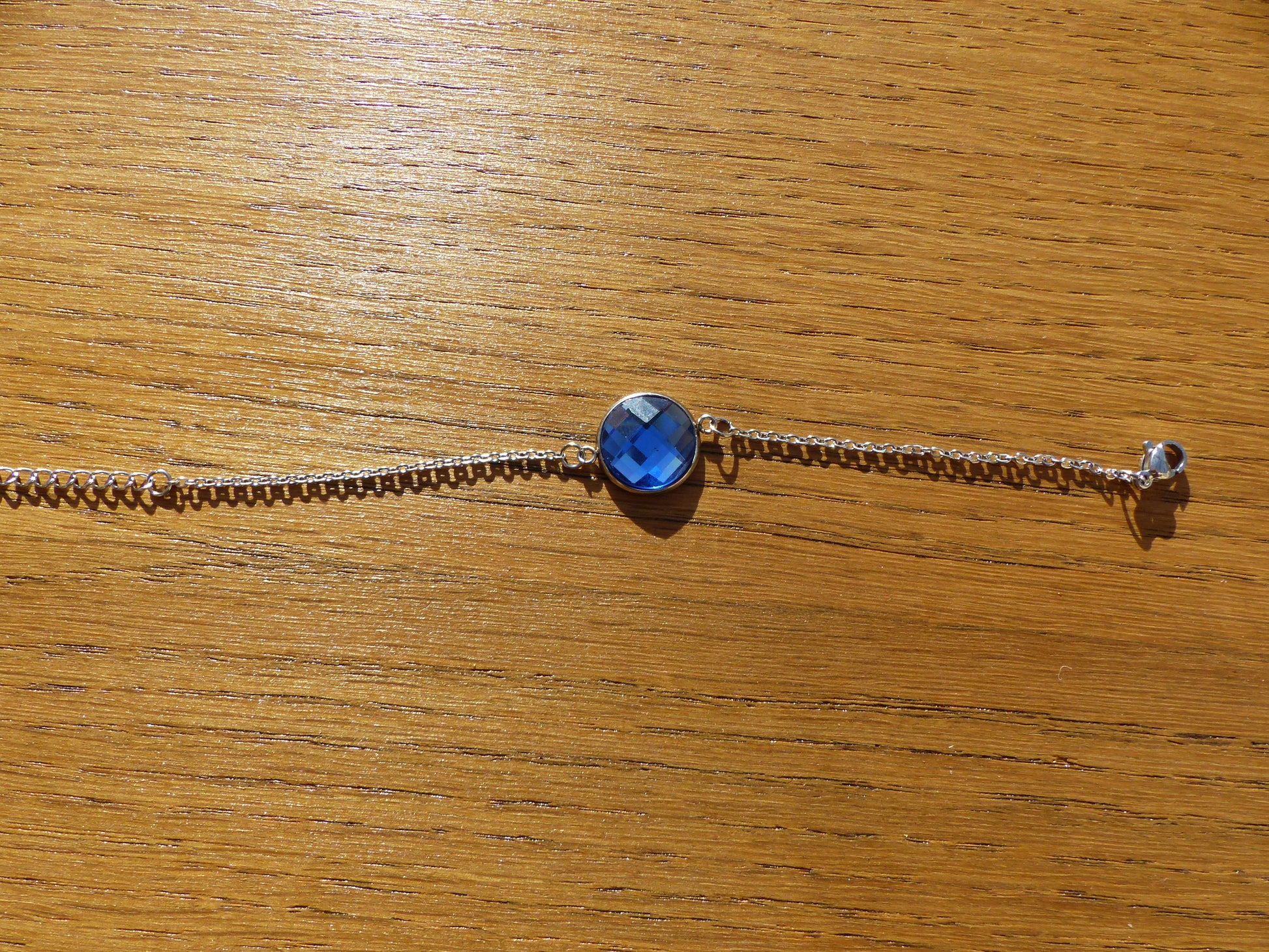 Bracelet en acier inoxydable argenté avec un cabochon de 14mm bleu